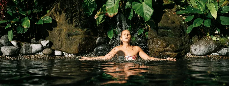 woman bathing in a natural pool