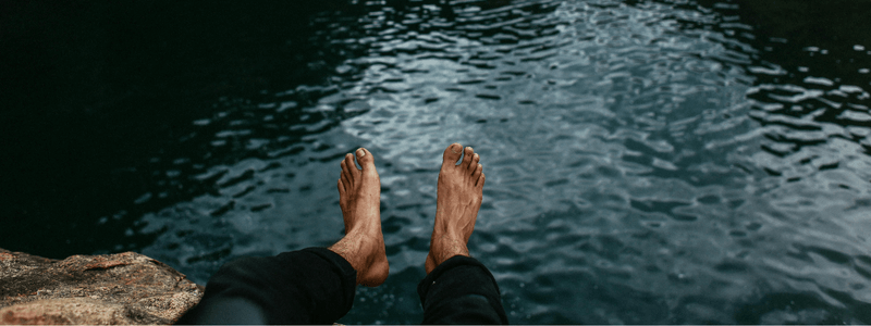 guys feet over water